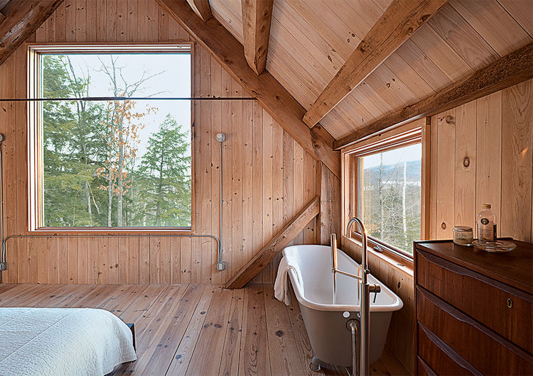 Eagle Pond House: A Modern Green Cabin Lined with Eastern White Pine